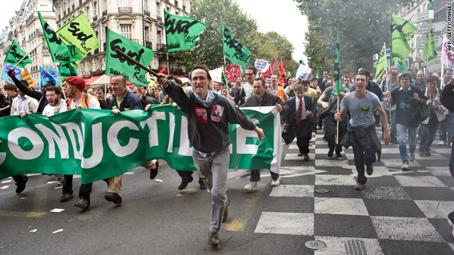 People march in Paris as part of a one-day national action against the government's retirement reform bill, September 23, 2010.