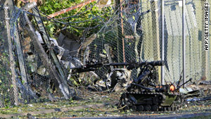 An army robot examines the site of a car bombing in Northern Ireland in April.