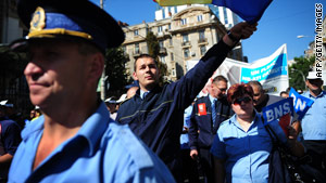 Romanian trade union members shout anti-government slogans in Bucharest.