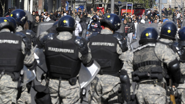 Anti-gay protesters face riot policemen in central Belgrade on October 10.