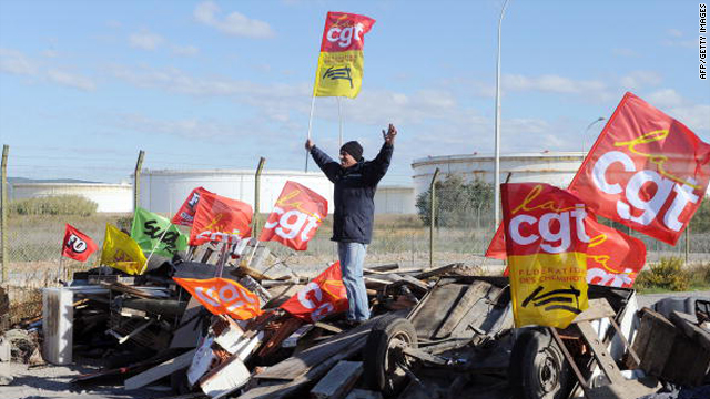 A striker joins the blockade of a fuel storage depots to protest against pension reform on October 18 in Frontignan, France.