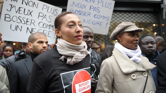 Protesters gather Saturday outside the Guerlain boutique in Paris, France, after a former exec made racial remarks.