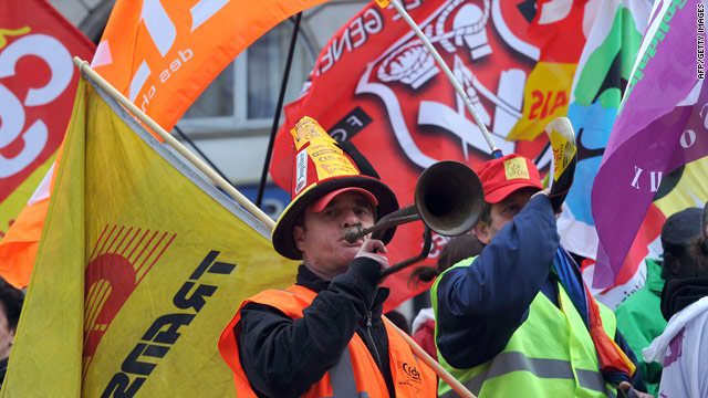 A French democratic Confederation of Labour (CFDT) militant blows in a trumpet on November 6, 2010 in Lille, France.
