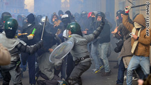 Police clash with angry protestors in Rome in the wake of lawmakers' confidence votes, narrowly in favor of Italian Prime Minister Silvio Berlusconi.