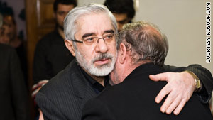 Mir Hossein Moussavi greets grieving relatives after nephew Saeed Ali Moussavi was killed Sunday during protests in Iran.