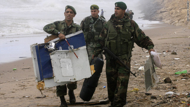 Lebanese troops carry the debris of an Ethiopian Boeing 737 that crashed into the Meditteranean.
