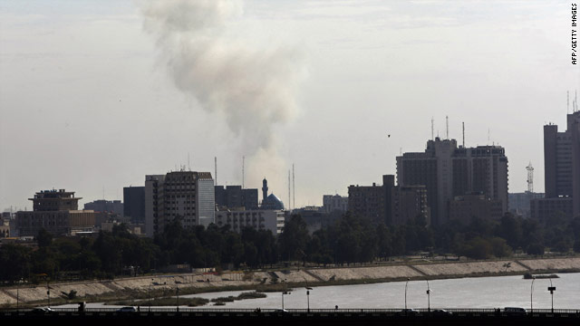 Smoke billows from the site of a car bomb attack on a government forensics office in Baghdad on Tuesday.
