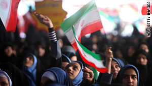 Schoolgirls mark the start of celebrations for the anniversary of the Islamic revolution.