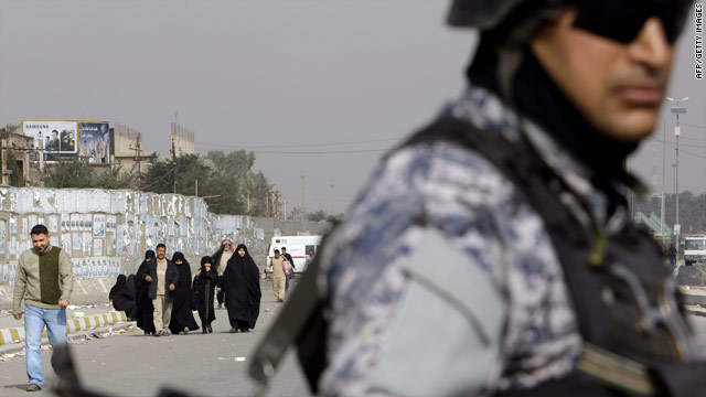 An Iraqi soldier stands guard as Muslim Shiite pilgrims head to the holy city of Karbala to take part in the Arbaeen.