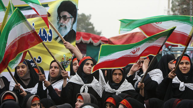 Schoolgirls mark the anniversary of the Islamic revolution at the Behesht-e Zahra (Zahra's Paradise) cemetery in Tehran.