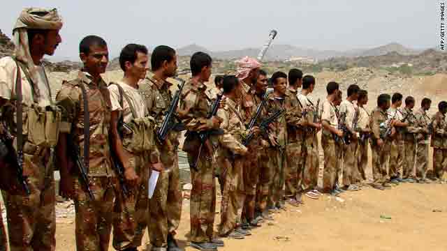 Yemeni troops gather to meet Defence Minister Mohammad Nasir Ahmad during his visit to the frontline in Saada on Friday.