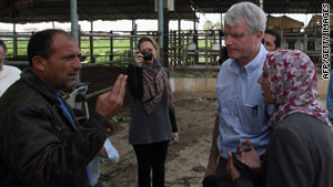 Rep. Brian Baird speaks to a Palestinian man during his latest visit to Gaza, still reeling from the 2009 incursion.