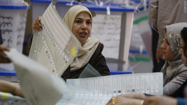 Iraqi electoral officials count votes Thursday at the Independent High Electoral Commission in Baghdad