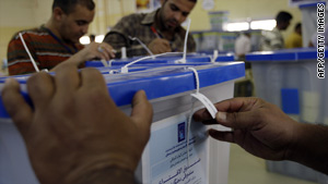Iraqis count and sort votes in Baghdad on Tuesday.