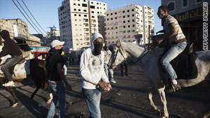 http://i.cdn.turner.com/cnn/2010/WORLD/meast/03/21/israel.clashes/story.westbank.clashes.afp..jpg