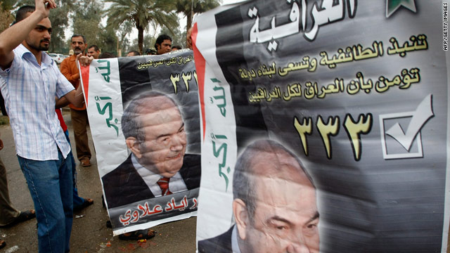 Supporters of Premier-elect Ayad Allawi carry his picture as they celebrate his party's victory in Baghdad.