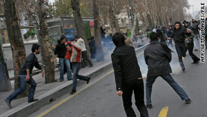 Demonstrators clash with Iranian security forces during a December rally in Tehran.