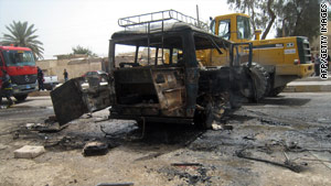 A bus devastated in a suicide bomb attack Monday south of Baghdad.