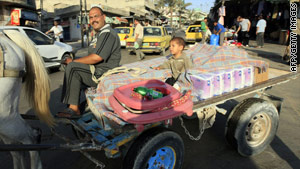 A Palestinian street vendor rides his cart in Gaza on June 17, the day Israel said it would ease a blockade of the territory.