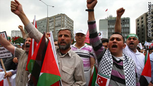 Pro-Palestinian demonstrators wave Turkish and Palestinian flags during a protest in Ankara on June 6.