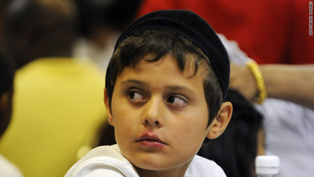 A young Muslim boy waits to break his fast during Ramadan. Over the four weeks of Ramadan, Muslim in 2010 will be looking at what it means to be a Muslim today.