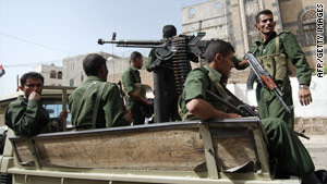 Security officers patrol a street in Sanaa, Yemen.