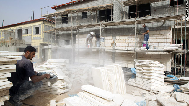 Workers build residential units last week in the Israeli settlement of Ariel, on the West Bank.