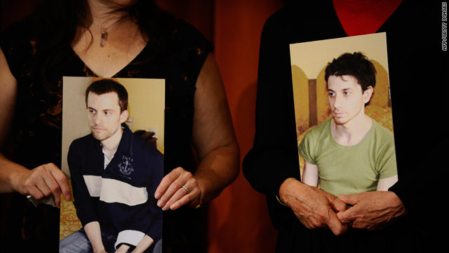 The mothers of Shane Bauer, shown left, and Josh Fattal hold pictures of the two hikers being held in Iran.
