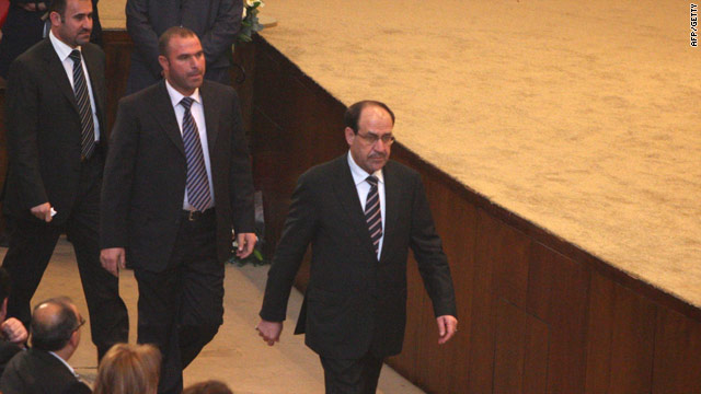 PM Nuri al-Maliki walks past lawmakers in Baghdad on Thursday -- leaders Friday were trying to salvage the power-sharing deal.