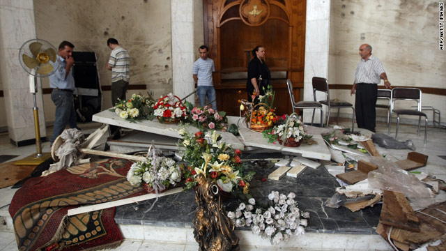 Iraqi Christians inspect the damage at Sayidat al-Nejat Cathedral in Baghdad after a deadly church siege on October 31, 2010.