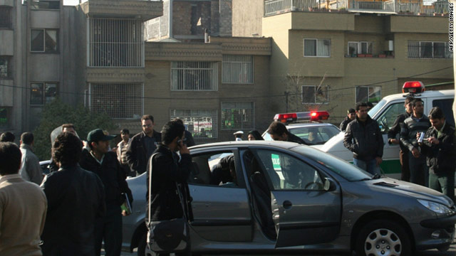 Iranian FARS news agency image shows police next to the vehicle allegedly belonging to Fereydoun Abbasi.
