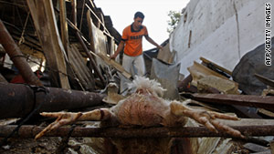 Palestinians inspect the damage  after an Israeli air strike earlier this month in southern Gaza Strip.