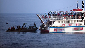 Israeli troops board a ship in a Gaza-bound aid flotilla in the Mediterranean Sea on May 31.