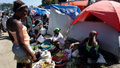 Scratching out life in Haitian tent cities