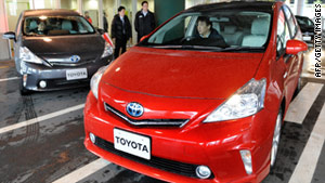 A journalist drives a Prius hybrid vehicle at a Toyota showroom in Tokyo on March 7.