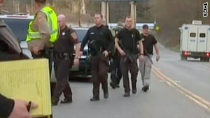 Police officers work at the scene of a shooting that killed two deputies on Sunday in southwest Virginia.