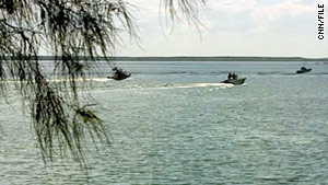 Officials  search Falcon Lake, Texas, for the body of American David Hartley in 2010.