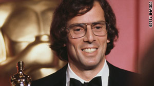 In 1978, Joseph Brooks accepts an Academy Award for best new song for "You Light Up My Life."