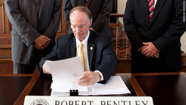 Gov. Robert Bentley signs Alabama's immigration legislation June 9. The law is set to take effect in September.