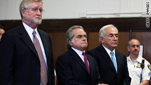 Dominique Strauss-Kahn, right, stands with his lawyers at a court hearing on July 1.
