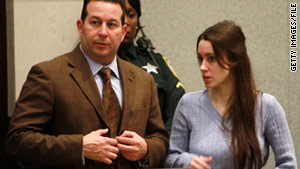 Defense attorney Jose Baez stands with Casey Anthony during her sentencing hearing on July 7.