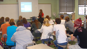 Student Rachel Flesher teaches Pat Mara's calculus class. Teaching helps students learn, Mara said.