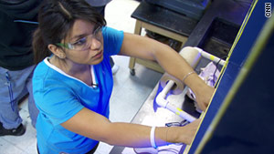 Maria Castro, 17, works on her team's robot at Carl Hayden Community High School.