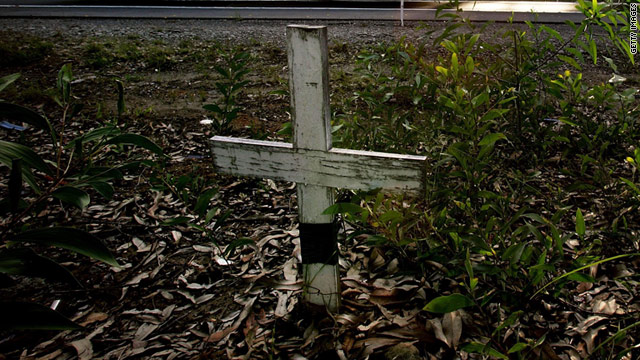 A cross marks the site of a death on an Australian roadside. Darin Strauss was haunted for years by a death he caused, a story he wrote about in his book "Half a Life."