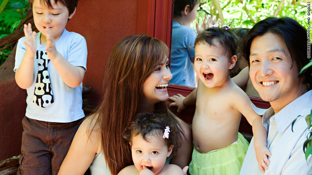 Actress Diane Farr poses for a family portrait with her husband, Seung Yong, and their three children.