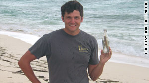 Clint Buffington displays a "fresh catch" on the beach.