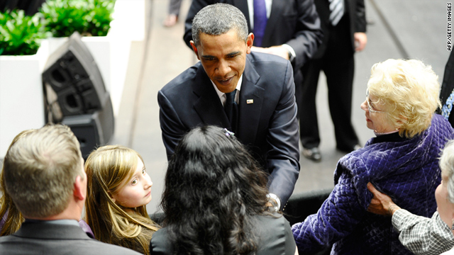 President Barack Obama greets family members of shooting victims during a memorial event in Tucson, Arizona.