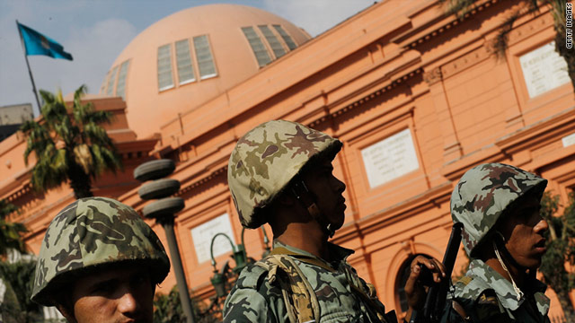 Soldiers stand guard outside of the Egyptian Museum in Tahrir Square on the morning of January 31 in central Cairo.