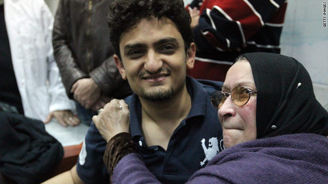 Just out of jail, Wael Ghonim is embraced by the mother of Khalid Said, who was allegedly beaten to death by police.