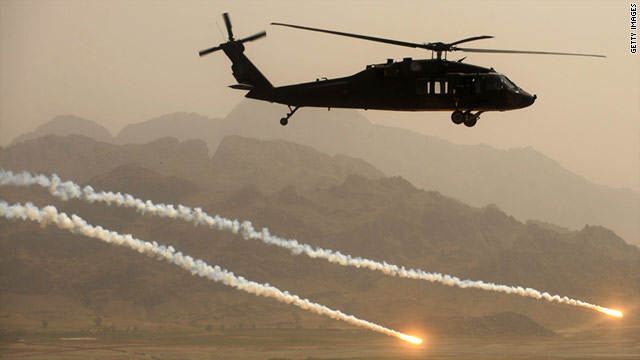A U.S. Army Blackhawk helicopter fires protective flares while  over Kandahar province in Afghanistan.